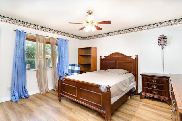 1502 Santa Fe Trl, Grand Prairie, TX 75052 - bedroom featuring light wood-style flooring, baseboards, and ceiling fan
