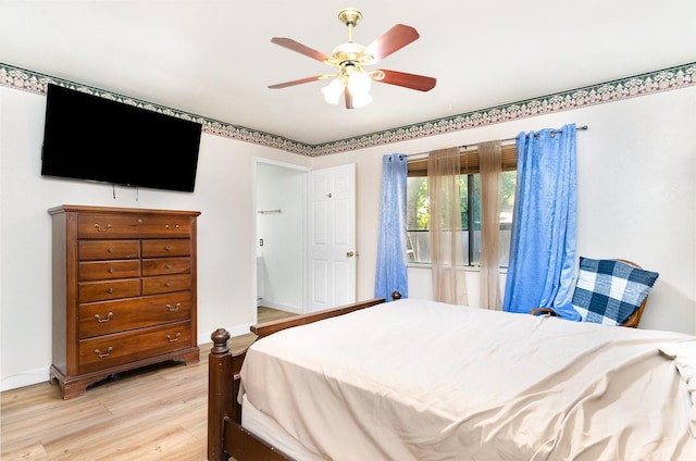 1502 Santa Fe Trl, Grand Prairie, TX 75052 - bedroom with light wood-type flooring, a ceiling fan, and baseboards
