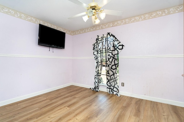 1502 Santa Fe Trl, Grand Prairie, TX 75052 - empty room featuring wood finished floors, baseboards, and a ceiling fan