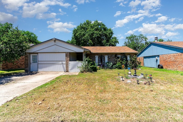 1502 Santa Fe Trl, Grand Prairie, TX 75052 - ranch-style home featuring a front yard, brick siding, and driveway