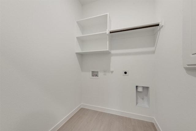 1802 Golden Sq, Cedar Hill, TX 75116 - laundry area featuring gas dryer hookup, washer hookup, light wood finished floors, electric dryer hookup, and baseboards