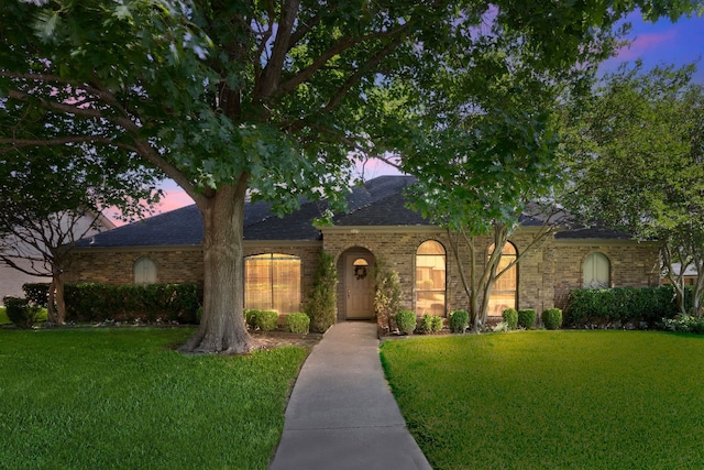 227 Meadowlark Ln, Duncanville, TX 75137 - view of front of home featuring a front lawn, a shingled roof, and brick siding