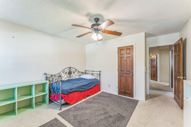 227 Meadowlark Ln, Duncanville, TX 75137 - carpeted bedroom featuring a textured ceiling and ceiling fan