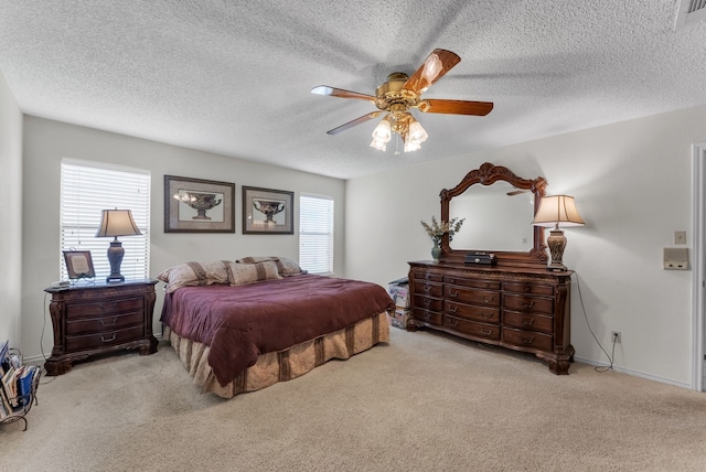 227 Meadowlark Ln, Duncanville, TX 75137 - carpeted bedroom with a textured ceiling, a ceiling fan, and baseboards