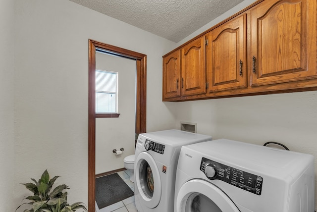227 Meadowlark Ln, Duncanville, TX 75137 - laundry room with independent washer and dryer, light tile patterned floors, and a textured ceiling