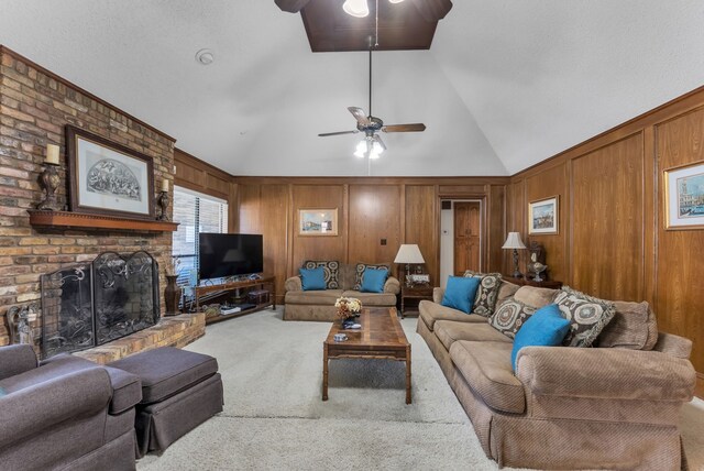 227 Meadowlark Ln, Duncanville, TX 75137 - carpeted living area featuring ceiling fan, vaulted ceiling, wood walls, and a brick fireplace