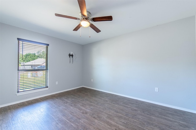 107 Oliver Wendell Ct, Mount Vernon, TX 75457 - empty room with dark wood-style floors, baseboards, and ceiling fan