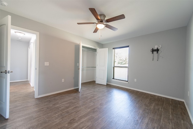 107 Oliver Wendell Ct, Mount Vernon, TX 75457 - unfurnished bedroom with dark wood finished floors, baseboards, a closet, and a ceiling fan
