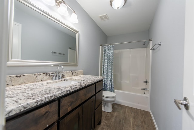 107 Oliver Wendell Ct, Mount Vernon, TX 75457 - bathroom featuring wood finished floors, vanity, toilet, shower / bathtub combination with curtain, and baseboards
