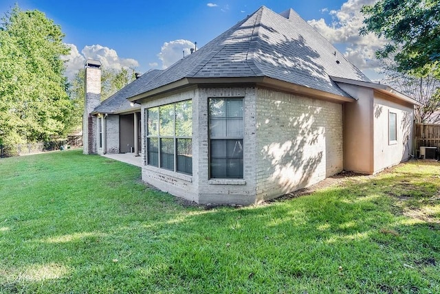 1010 Toledano Cir, Shreveport, LA 71106 - rear view of house with brick siding, cooling unit, a chimney, and roof with shingles