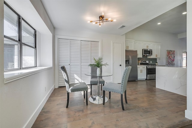 5607 Emrose Cir, Dallas, TX 75227 - dining area with a chandelier, dark wood-style flooring, baseboards, and recessed lighting