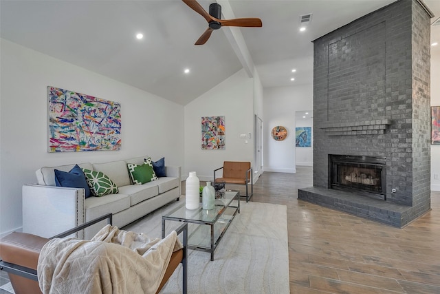 5607 Emrose Cir, Dallas, TX 75227 - living room featuring beamed ceiling, ceiling fan, high vaulted ceiling, wood finished floors, and a fireplace