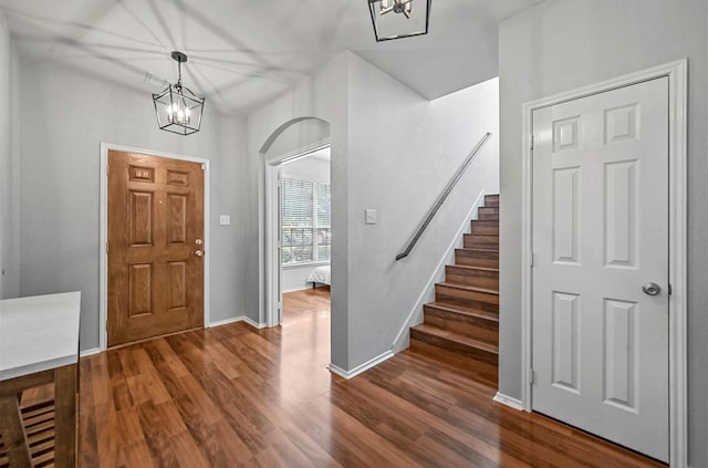 405 Cypress Hill Dr, Mckinney, TX 75071 - foyer with a chandelier, stairs, and dark wood-type flooring