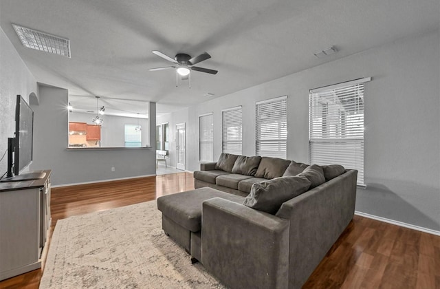 405 Cypress Hill Dr, Mckinney, TX 75071 - living area featuring a ceiling fan, dark wood finished floors, and baseboards