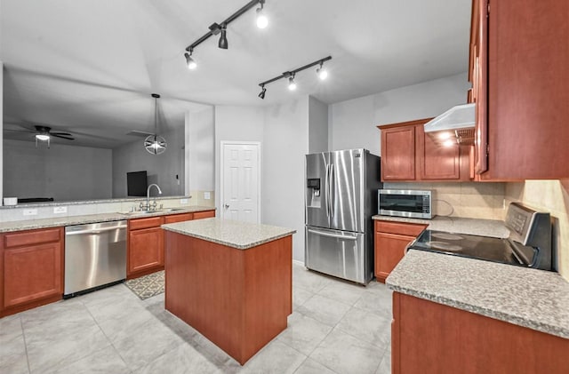 405 Cypress Hill Dr, Mckinney, TX 75071 - kitchen featuring stainless steel appliances, a sink, a ceiling fan, a kitchen island, and wall chimney range hood