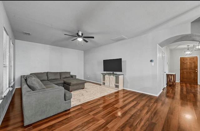 405 Cypress Hill Dr, Mckinney, TX 75071 - living room featuring arched walkways, ceiling fan, wood finished floors, and baseboards