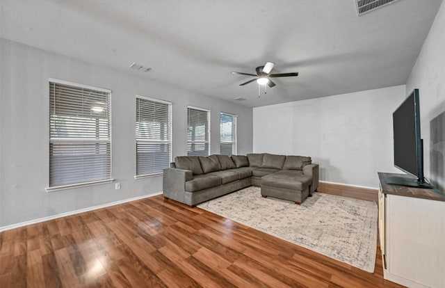 405 Cypress Hill Dr, Mckinney, TX 75071 - living room featuring wood finished floors, a ceiling fan, and baseboards