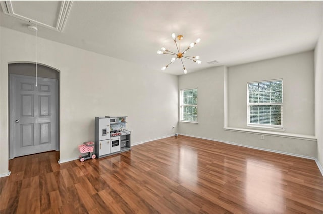 405 Cypress Hill Dr, Mckinney, TX 75071 - spare room featuring attic access, plenty of natural light, wood finished floors, and baseboards