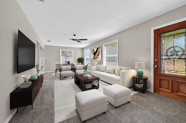 731 Ray Dr, Denison, TX 75020 - living area featuring carpet flooring, ceiling fan, and baseboards