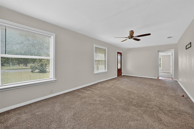 731 Ray Dr, Denison, TX 75020 - unfurnished room featuring healthy amount of natural light, carpet flooring, a ceiling fan, and baseboards