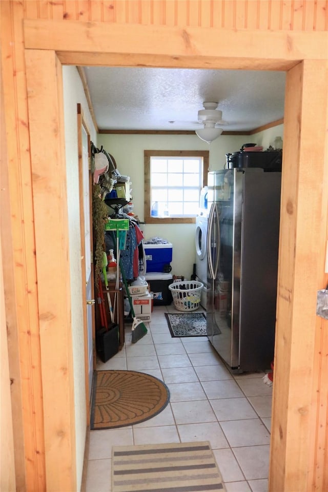 307 Cedar St, Palo Pinto, TX 76484 - laundry area featuring light tile patterned flooring and washer and clothes dryer