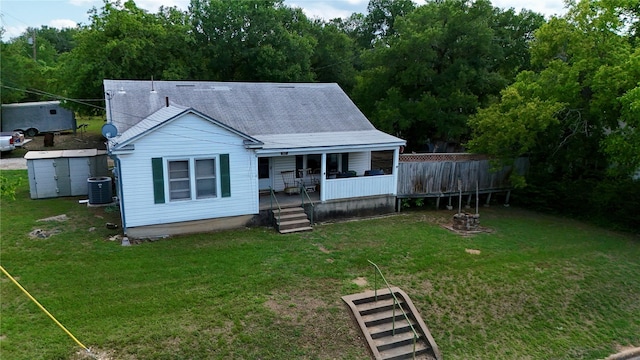 307 Cedar St, Palo Pinto, TX 76484 - view of front of house with a front yard, a porch, and central air condition unit