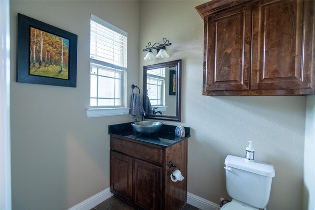 665 Amanda Lee, Combine, TX 75159 - bathroom featuring vanity, toilet, and baseboards