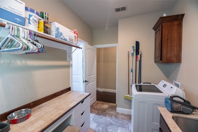 665 Amanda Lee, Combine, TX 75159 - laundry room with cabinet space, stone finish flooring, washer and dryer, and baseboards