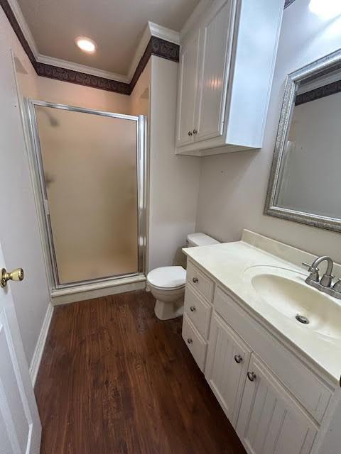 5500 Vz County Road 3415, Wills Point, TX 75169 - full bath with toilet, vanity, a stall shower, wood finished floors, and ornamental molding