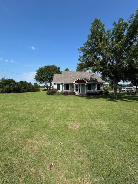 5500 Vz County Road 3415, Wills Point, TX 75169 - view of front facade with covered porch and a front lawn