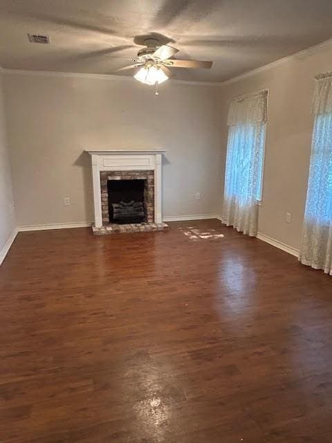 5500 Vz County Road 3415, Wills Point, TX 75169 - unfurnished living room featuring crown molding, ceiling fan, baseboards, dark wood-style flooring, and a fireplace with raised hearth