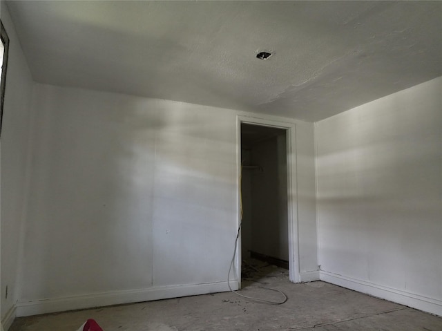 1428 Texas St, Vernon, TX 76384 - unfurnished bedroom featuring a closet and unfinished concrete floors