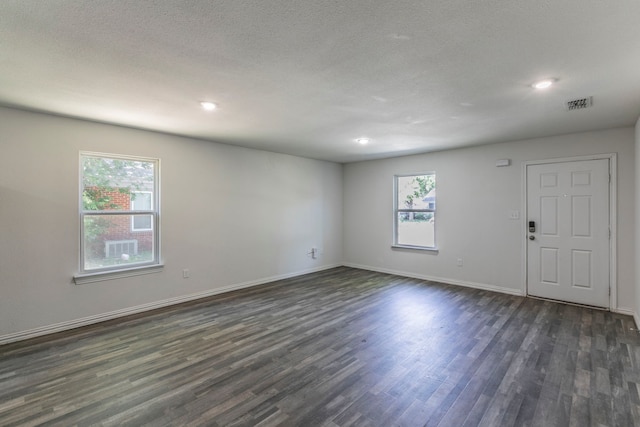 1718 Chestnut St, Abilene, TX 79602 - empty room featuring dark wood-style floors, baseboards, and recessed lighting