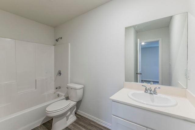 1718 Chestnut St, Abilene, TX 79602 - bathroom with toilet, wood finished floors, vanity, shower / washtub combination, and baseboards