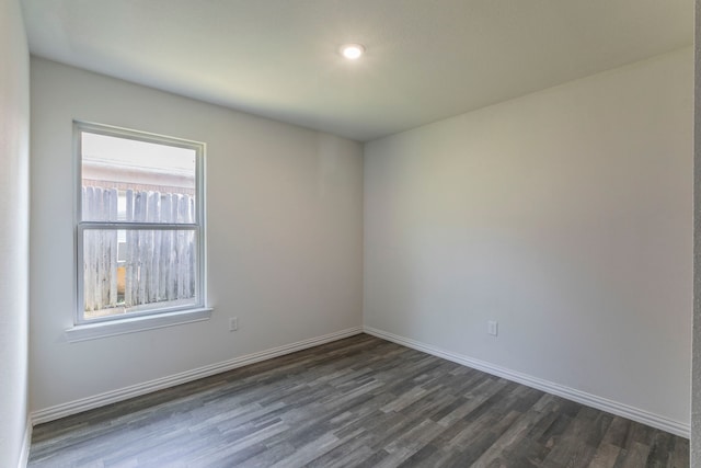 1718 Chestnut St, Abilene, TX 79602 - empty room with dark wood-type flooring and baseboards