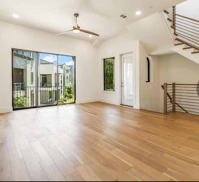7844 Secluded Ave, Plano, TX 75024 - unfurnished living room with a ceiling fan, healthy amount of natural light, light wood finished floors, baseboards, and recessed lighting