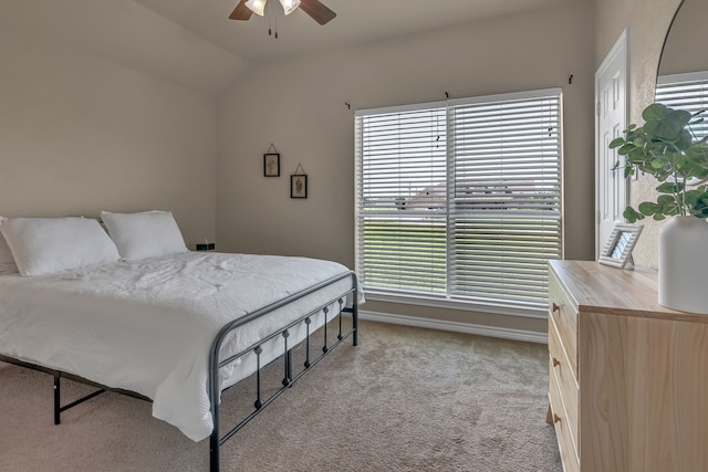 111 Ladonna Ct, Decatur, TX 76234 - bedroom with light colored carpet, multiple windows, lofted ceiling, a ceiling fan, and baseboards