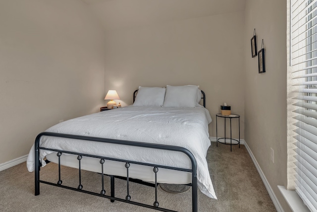 111 Ladonna Ct, Decatur, TX 76234 - bedroom featuring carpet floors, vaulted ceiling, and baseboards