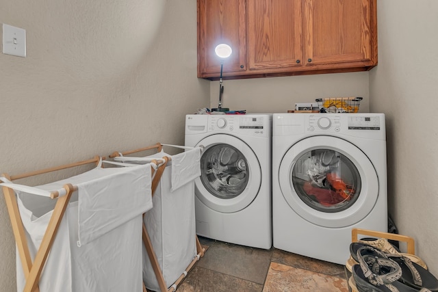 111 Ladonna Ct, Decatur, TX 76234 - washroom with washing machine and dryer, stone finish floors, and cabinet space