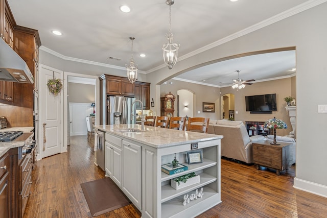 3308 Linkwood, The Colony, TX 75056 - kitchen featuring arched walkways, a sink, a ceiling fan, appliances with stainless steel finishes, and light stone counters
