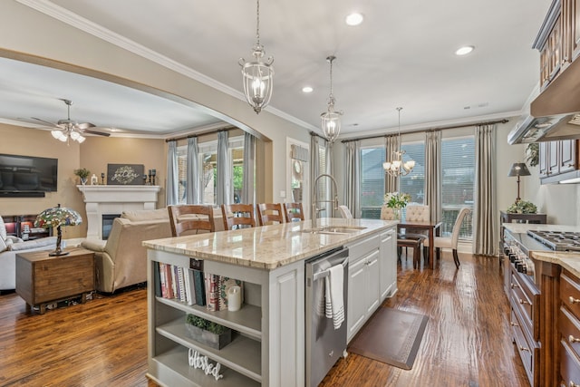 3308 Linkwood, The Colony, TX 75056 - kitchen with stainless steel appliances, arched walkways, a chandelier, light stone countertops, and white cabinets
