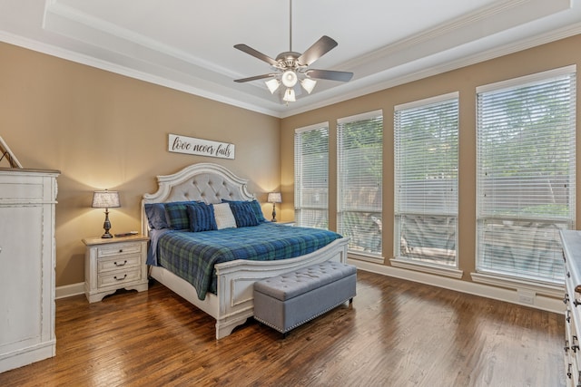 3308 Linkwood, The Colony, TX 75056 - bedroom featuring a tray ceiling, multiple windows, crown molding, wood finished floors, and a ceiling fan
