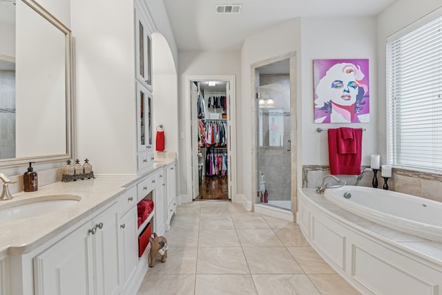 3308 Linkwood, The Colony, TX 75056 - full bath with a shower stall, a garden tub, vanity, a walk in closet, and tile patterned flooring