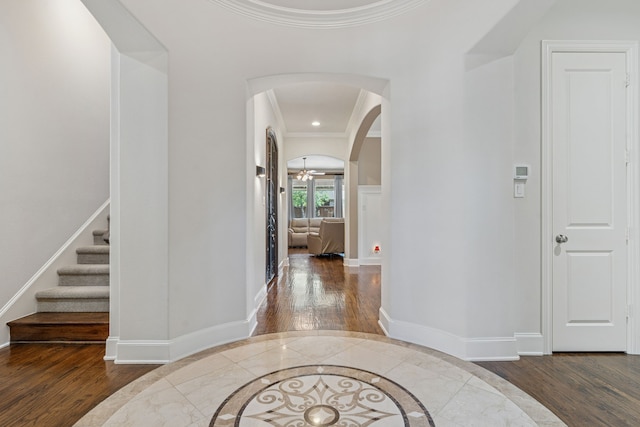 3308 Linkwood, The Colony, TX 75056 - foyer featuring wood finished floors, arched walkways, inlaid floor details, baseboards, and recessed lighting