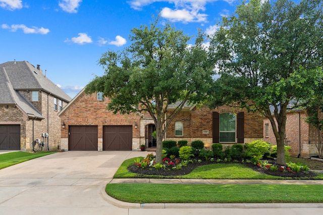 3308 Linkwood, The Colony, TX 75056 - view of front of property with brick siding, concrete driveway, and a garage