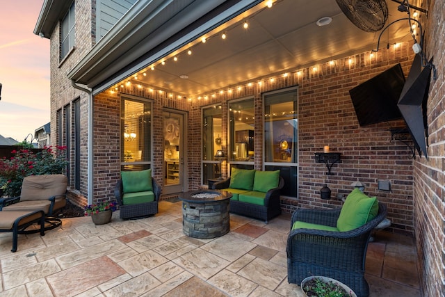 3308 Linkwood, The Colony, TX 75056 - patio terrace at dusk featuring a patio and an outdoor living space with a fire pit
