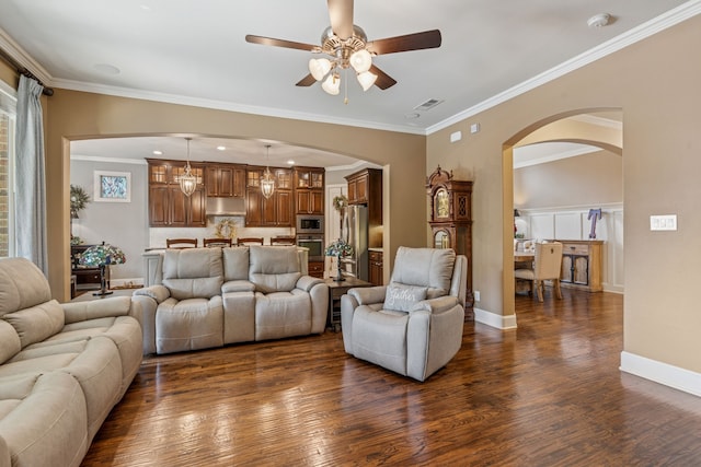 3308 Linkwood, The Colony, TX 75056 - living room featuring arched walkways, dark wood-type flooring, ceiling fan, and ornamental molding