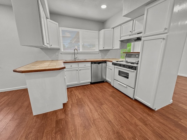 3837 Finley Rd, Irving, TX 75062 - kitchen with white gas range, a sink, dishwasher, dark wood finished floors, and recessed lighting