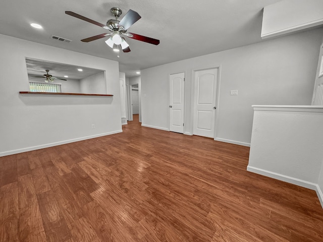 3837 Finley Rd, Irving, TX 75062 - unfurnished living room featuring a ceiling fan, baseboards, wood finished floors, and recessed lighting