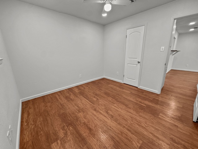 3837 Finley Rd, Irving, TX 75062 - unfurnished room with wood finished floors, a ceiling fan, and baseboards